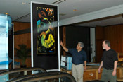 ..HEI's David Franco & Paul Barry with poster, 3rd floor, Hilton, NY