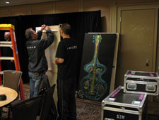 HEI's David Franco supervises hanging of the JazzArt